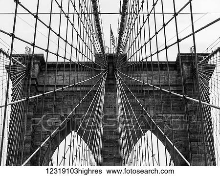 Stock Photograph - Grid pattern of supports on the Brooklyn Bridge; New York City, New York, United States of America. Fotosearch