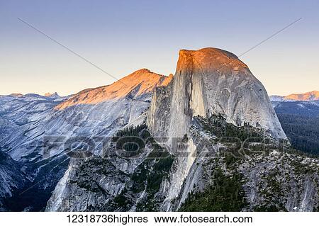 Stock Photograph - Half Dome at sunset from Glacier Point, Yosemite National Park; California, United States of America. Fotosearch