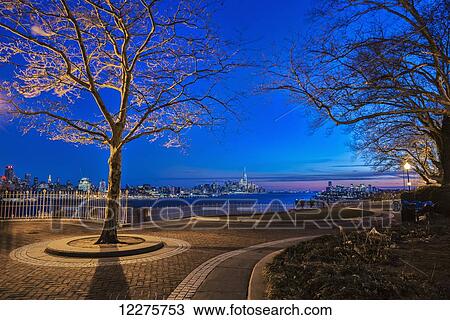 Hamilton Park at twilight with New York City skyline in background; Weehawken, New Jersey, United States of America View Large Photo Image Stock Image - Hamilton Park at twilight with New York City skyline in background; Weehawken, New Jersey, United States of America. Fotosearch