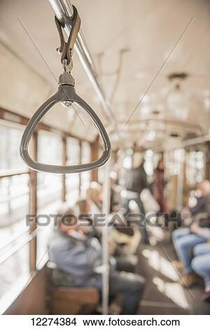 Handle hanging from bar in a tram; Milan, Lombardy, Italy View Large Photo Image Picture - Handle hanging from bar in a tram; Milan, Lombardy, Italy. Fotosearch