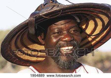 Happy Dogon man wearing fulani straw hat in Sangha, Mali View Large Photo Image Stock Photo - Happy Dogon man wearing fulani straw hat in Sangha, Mali. Fotosearch