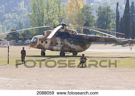 Helicopter On A Landing Pad After The 8 October 2005 Earthquake, Garhi Dopatta, Azad Jammu & Kashmir, Pakistan View Large Photo Image Stock Photo - Helicopter On A Landing Pad After The 8 October 2005 Earthquake, Garhi Dopatta, Azad Jammu & Kashmir, Pakistan. Fotosearch
