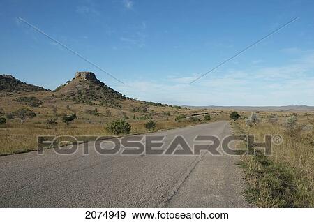Stock Photo - Highway No. 1 Through The Eroded Jurassic Sandstone Massif In Isalo National Park, Fianarantsoa Province, Madagascar. Fotosearch