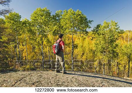 Stock Image - Hiking in Whiteshell Provincial Park in autumn; Manitoba, Canada. Fotosearch
