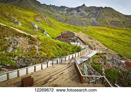 Stock Image - Historic buildings and tracks of the Independence Mine State Historic Park, Hatcher Pass, Southcentral Alaska, Summer.. Fotosearch