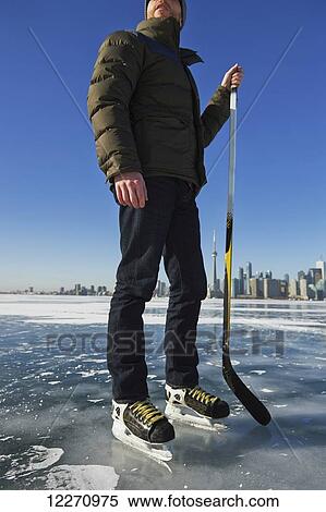 Hockey player and city skyline from Ward's Island; Toronto, Ontario, Canada View Large Photo Image Stock Photography - Hockey player and city skyline from Ward's Island; Toronto, Ontario, Canada. Fotosearch