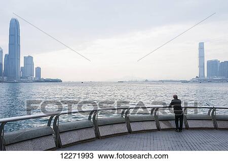 Stock Image - Hong Kong bay's landscape, with Kowloon district on the right and Hong Kong Island on the left; China. Fotosearch