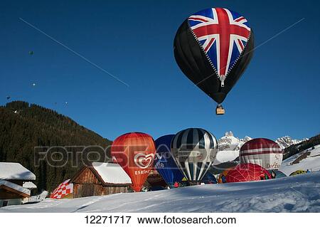 Stock Photo - Hot air balloons taking off during the ski resort's annual hot air balloon festival, including one with the British Union Jack; Filzmoos, Austria. Fotosearch