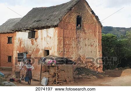 Stock Photo - House Along The Road Between Ambositra & Ambavalao, Fianarantsoa Province, Madagascar. Fotosearch