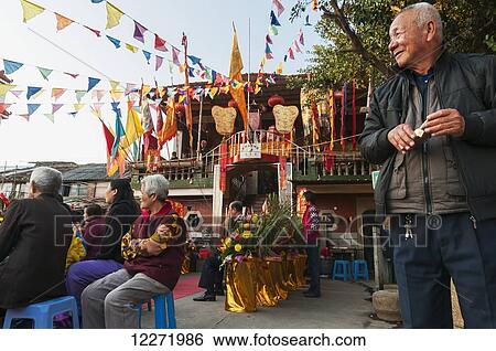 Stock Photograph - Humble Min Nan Opera in small neighbourhood; Xiamen, Fujian province, China. Fotosearch