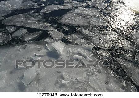 Stock Photo - Ice breaking up in harbor; Toronto, Ontario, Canada. Fotosearch