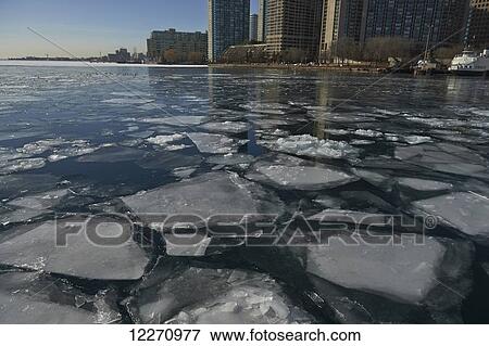 Stock Photo - Ice in waterfront harbor; Toronto, Ontario, Canada. Fotosearch