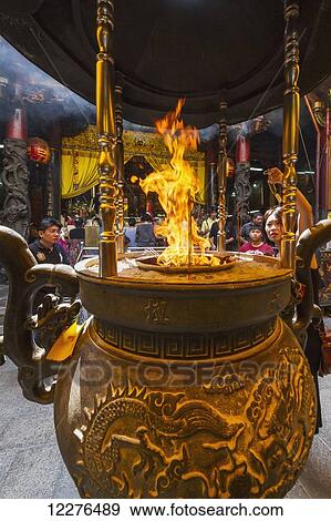 Incense and paper offerings burning in an incense burner at the Altar of Heaven (Tiantan); Tainan, Taiwan View Large Photo Image Stock Photo - Incense and paper offerings burning in an incense burner at the Altar of Heaven (Tiantan); Tainan, Taiwan. Fotosearch