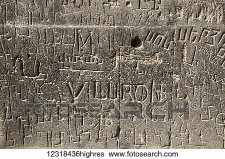 Stock Photograph - Inscriptions on a stone wall at Khor Virap Monastery; Ararat Province, Armenia. Fotosearch
