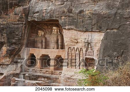 Stock Photo - Jain Sculptures Carved In To The Cliff On The Southern Approach To The Fort, Gwalior, Madhya Pradesh, India. Fotosearch