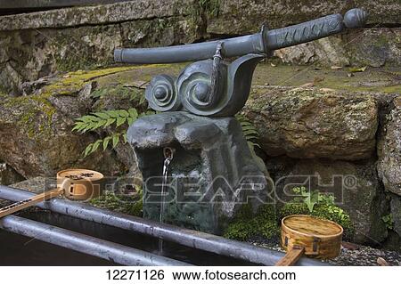 Japanese shrine water fountain with samurai sword; Kyoto, Japan View Large Photo Image Stock Photograph - Japanese shrine water fountain with samurai sword; Kyoto, Japan. Fotosearch