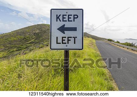 Stock Photograph - Keep left sign; St. Croix, Virgin Islands, United States of America. Fotosearch