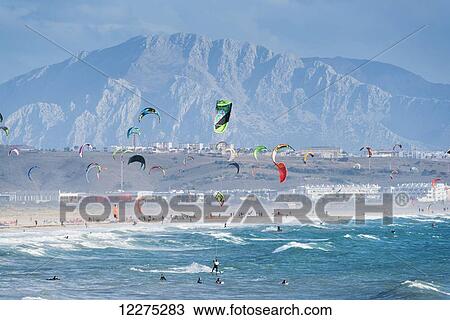 Stock Image - Kitesurfing with Tarifa and Morocco in the background; Tarifa, Cadiz, Andalusia, Spain. Fotosearch