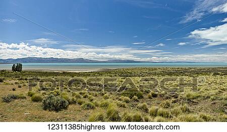 Stock Photograph - Lago Argentino amidst the pampas of the Patagonian province of Santa Cruz is the biggest freshwater lake in Argentina; Santa Cruz Province, Argentina. Fotosearch