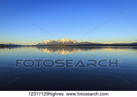 Stock Photograph - Lake Sarmiento and Torres del Paine National Park in Chilean Patagonia with Cordillera Paine granite peaks, iconic centerpiece of the park; Magallanes, Chile. Fotosearch