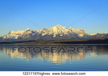 Stock Photograph - Lake Sarmiento and Torres del Paine National Park in Chilean Patagonia with Cordillera Paine granite peaks, iconic centerpiece of the park; Magallanes, Chile. Fotosearch