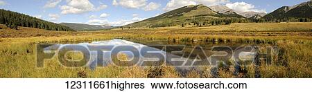 Landscape of a mountain reflected in a lake; Alaska, United States of America View Large Photo Image Stock Photograph - Landscape of a mountain reflected in a lake; Alaska, United States of America. Fotosearch