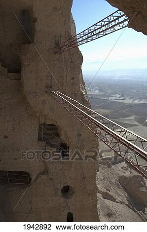 Large Scaffolding For The Emergency Consolidation Of The Niche Of The Small Buddha, Destroyed By The Taliban In 2001 In Bamiyan, Bamian Province, Afghanistan View Large Photo Image Stock Image - Large Scaffolding For The Emergency Consolidation Of The Niche Of The Small Buddha, Destroyed By The Taliban In 2001 In Bamiyan, Bamian Province, Afghanistan. Fotosearch