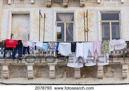 Stock Image - Laundry Hanging From A Balcony, Valletta, Malta. Fotosearch