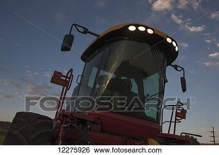 Stock Photograph - LED lighting on New Holland H8060 self propelled mower; Preston, Idaho, United States of America. Fotosearch
