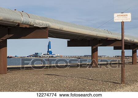 Liberty Oil Rig and Pipelines viewed from the Endicott Island causeway, Prudhoe Bay Oil field, North Slope, Arctic Alaska, Summer View Large Photo Image Picture - Liberty Oil Rig and Pipelines viewed from the Endicott Island causeway, Prudhoe Bay Oil field, North Slope, Arctic Alaska, Summer. Fotosearch