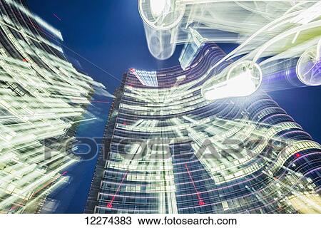 Stock Image - Long exposure of lights and the Unicredit tower in the finance district; Milan, Lombardy, Italy. Fotosearch