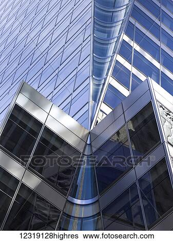 Low angle view of the corner of a building with a facade of windows; New York City, New York, United States of America View Large Photo Image Stock Photograph - Low angle view of the corner of a building with a facade of windows; New York City, New York, United States of America. Fotosearch