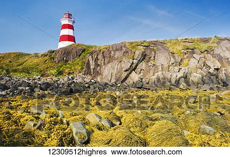 Stock Photograph - Low tide at Brier Island Lighthouse, Bay of Fundy; Brier Island, Nova Scotia, Canada. Fotosearch