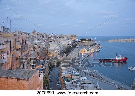 Lower Barrakka Gardens Showing The Monument To Sir Alexander Ball, With The Old Customs House And The Breakwater Below At Dusk, Valletta, Malta View Large Photo Image Stock Photo - Lower Barrakka Gardens Showing The Monument To Sir Alexander Ball, With The Old Customs House And The Breakwater Below At Dusk, Valletta, Malta. Fotosearch
