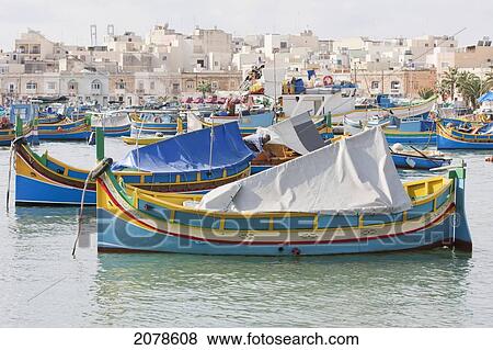 Stock Photo - Luzzus, Traditional Maltese Fishing Boats In The Harbour, Marsaxlokk, Malta. Fotosearch