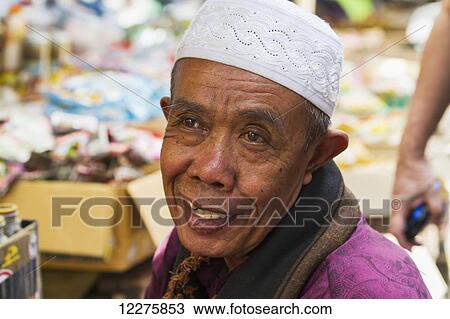 Man at the weekly market, Semparu, Lombok, West Nusa Tenggara, Indonesia View Large Photo Image Stock Image - Man at the weekly market, Semparu, Lombok, West Nusa Tenggara, Indonesia. Fotosearch
