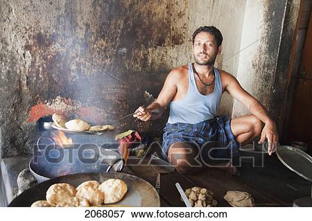 Stock Photo - Man Frying Food, Bodhgaya, Bihar, India. Fotosearch
