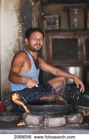 Man Frying Food, Bodhgaya, Bihar, India View Large Photo Image Stock Photograph - Man Frying Food, Bodhgaya, Bihar, India. Fotosearch