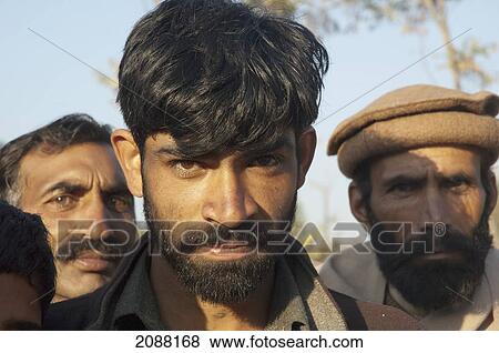 Stock Photo - Man In A Relief Camp After The 8 October 2005 Earthquake, Bagh, Azad Kashmir, Pakistan. Fotosearch