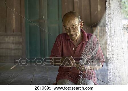 Man Making A Fish Net, Laos View Large Photo Image Stock Photography - Man Making A Fish Net, Laos. Fotosearch