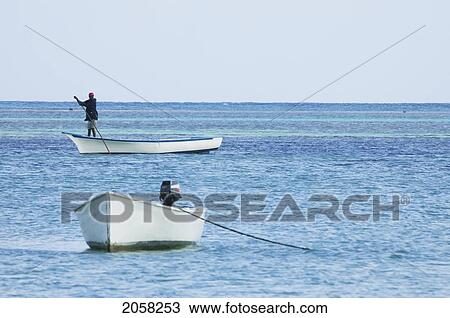 Man On A Boat By Cap Malheureux, Mauritius View Large Photo Image Stock Image - Man On A Boat By Cap Malheureux, Mauritius. Fotosearch