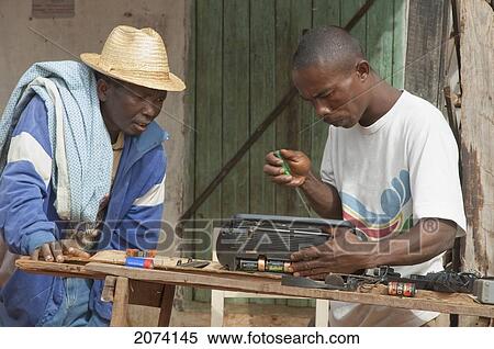 Man Repairing A Radio In Ambalavao, Fianarantsoa Province, Madagascar View Large Photo Image Stock Photography - Man Repairing A Radio In Ambalavao, Fianarantsoa Province, Madagascar. Fotosearch