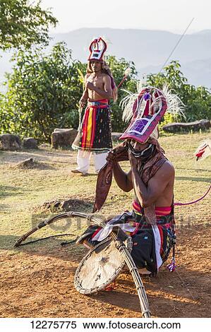Manggarai men wearing traditional headdress wrapped with cloth and wielding shields and bamboo whips before a caci, a ritual whip fight, Melo village, Flores, East Nusa Tenggara, Indonesia View Large Photo Image Stock Photography - Manggarai men wearing traditional headdress wrapped with cloth and wielding shields and bamboo whips before a caci, a ritual whip fight, Melo village, Flores, East Nusa Tenggara, Indonesia. Fotosearch