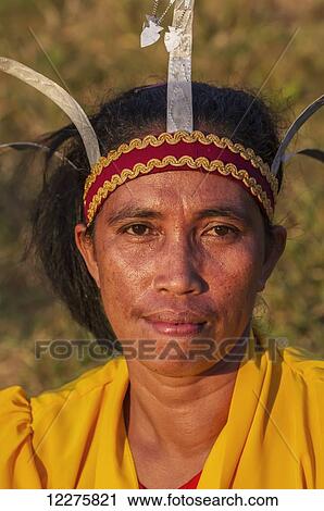 Manggarai woman wearing a traditional headdress, Melo village, Flores, East Nusa Tenggara, Indonesia View Large Photo Image Stock Image - Manggarai woman wearing a traditional headdress, Melo village, Flores, East Nusa Tenggara, Indonesia. Fotosearch