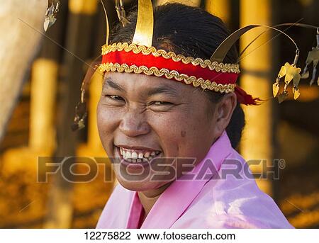 Stock Image - Manggarai woman wearing a traditional headdress, Melo village, Flores, East Nusa Tenggara, Indonesia. Fotosearch