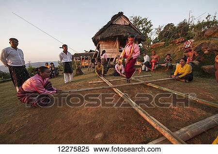 Stock Photography - Manggarai women participating in Tetek Alu, the traditional bamboo pole jumping game, Melo village, Flores, East Nusa Tenggara, Indonesia. Fotosearch