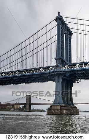 Stock Photograph - Manhattan Bridge, with the Brooklyn Bridge in the distance; New York City, New York, United States of America. Fotosearch