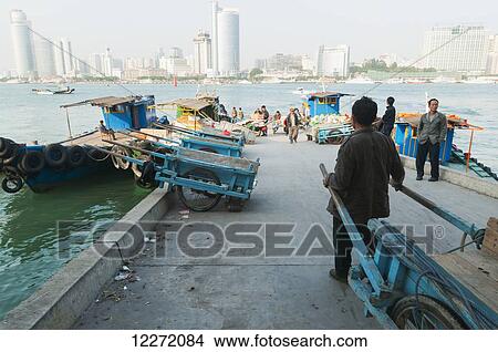 Manual transportation of goods on Gulangyu Island; Xiamen, Fujian province, China View Large Photo Image Picture - Manual transportation of goods on Gulangyu Island; Xiamen, Fujian province, China. Fotosearch