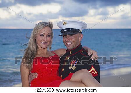 Marine and his lady getting engaged on the beach; Kailua, Island of Hawaii, Hawaii, United States of America View Large Photo Image Stock Image - Marine and his lady getting engaged on the beach; Kailua, Island of Hawaii, Hawaii, United States of America. Fotosearch