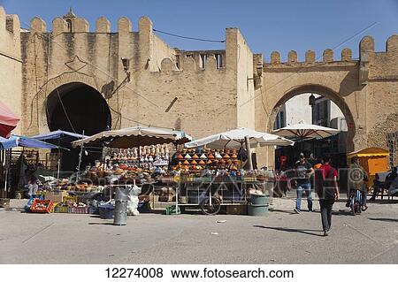 Stock Photo - Market stalls beside the Kasbah Gateway into the Medina; Kairouan, Tunisia. Fotosearch